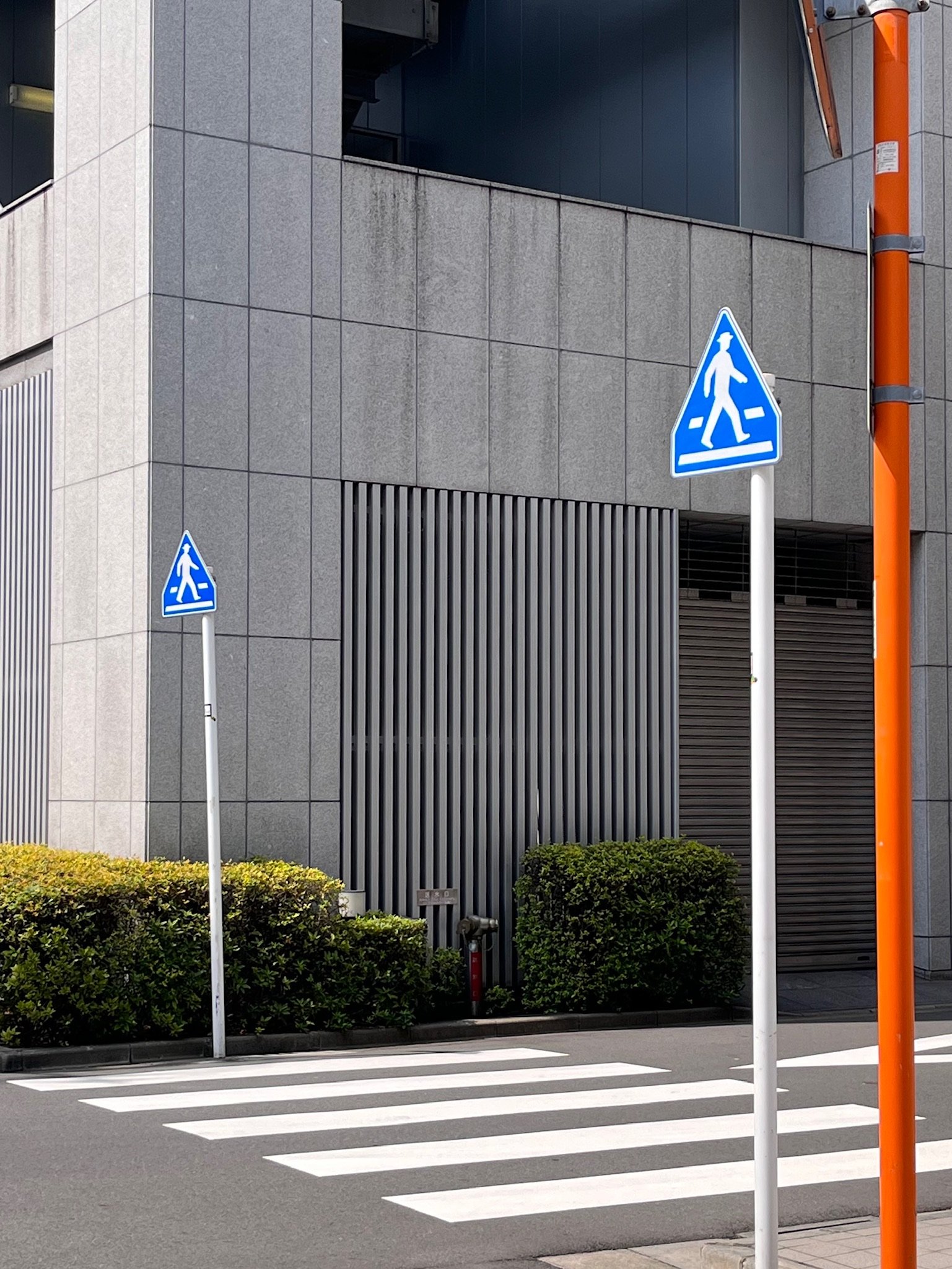 Pedestrian cross and signs.