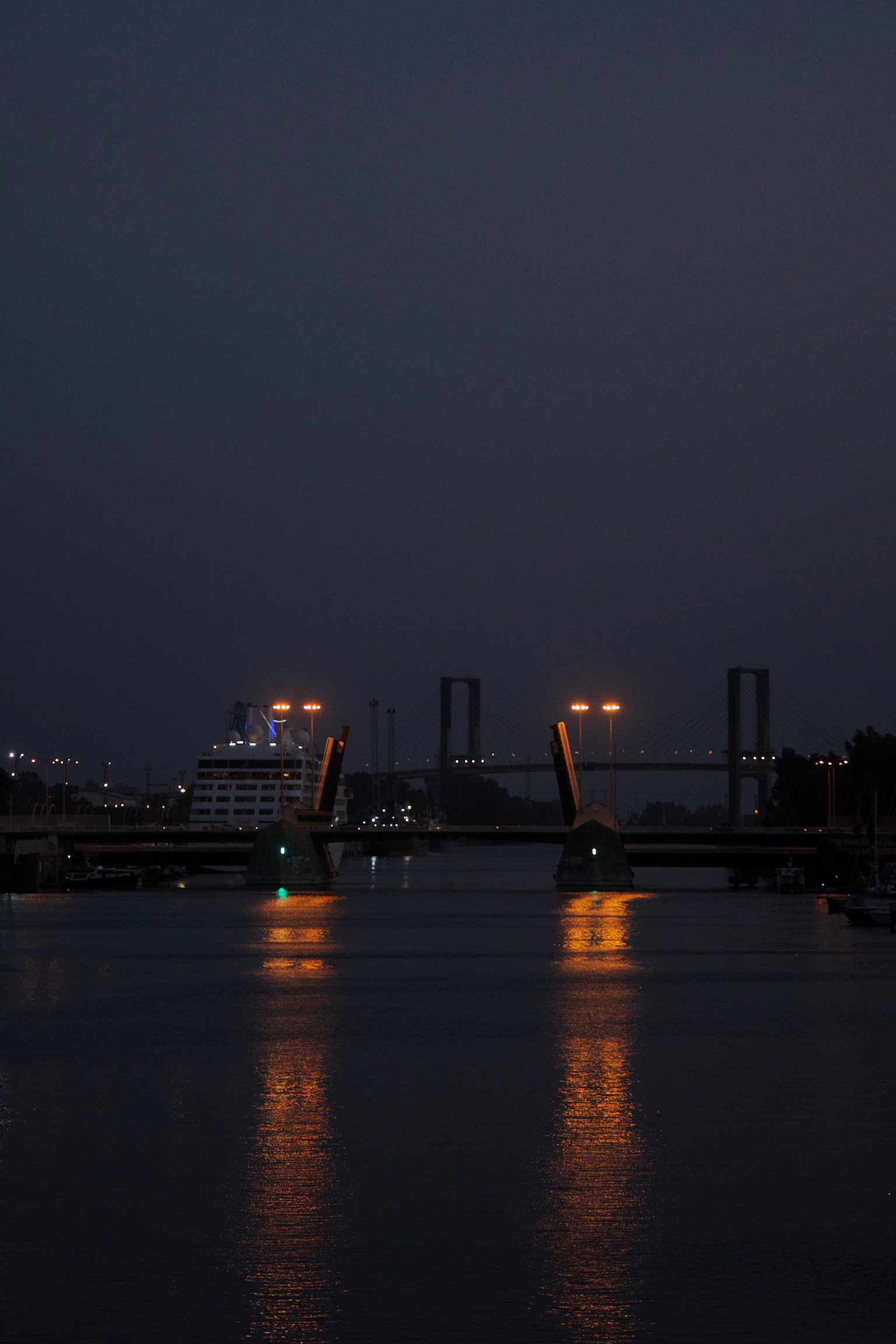 a bridge over a river at night