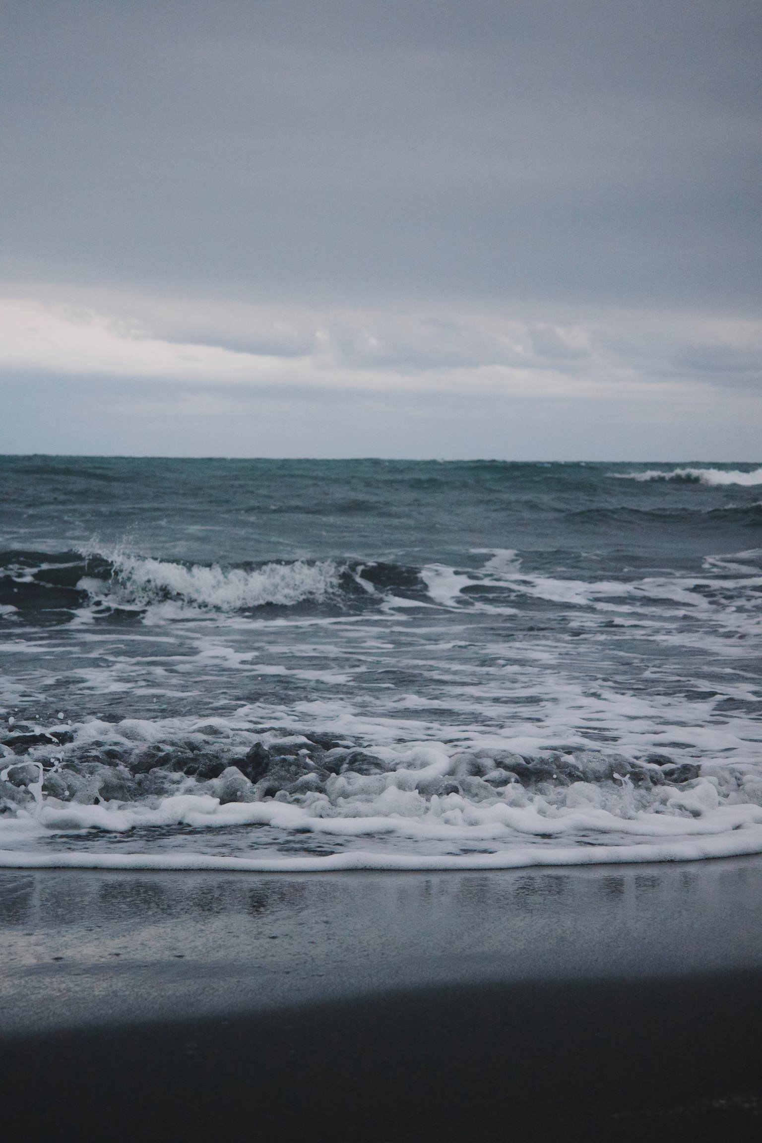 The ocean, on a cloudy day. Bluish gray water.